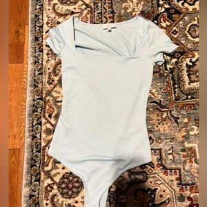 Live in the moment body suit